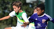 Disney Preseason Soccer Kick-Off Event Opposing youth soccer players vie for control of a ball