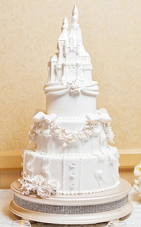Wedding Cake Wednesday Sleeping Beauty Castle Disney Weddings This Week S Wedding Cake Wednesday Is A Beautiful Tribute To Disneyland Sleeping Beauty Castle The Three Tier Stunner Adorned With Roses Bows