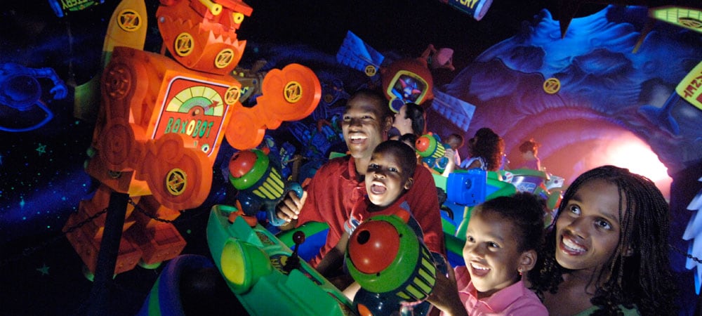 Family Blasting Targets at Buzz Lightyear Astro Blasters