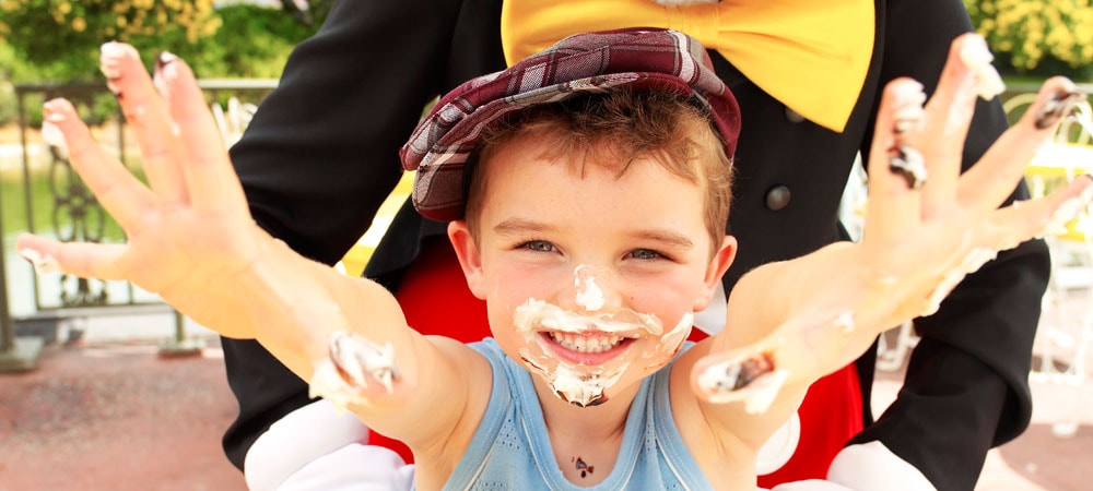Happy Boy with Frosting on His Face and Hands