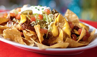 Special Functions Nachos with chili, shredded lettuce, jalapeños, diced tomatoes and sour cream