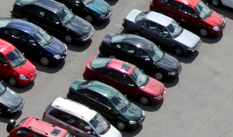 Parking Two rows of cars parked in a parking lot