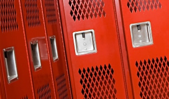 Lockers and Equipment Storage Five empty clothes lockers in a locker room