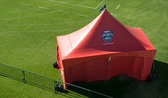 Tent Policy A large tent near the corner of a soccer field