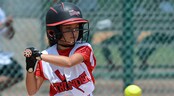 USSSA Girls Fast Pitch World Series I A young softball batter keeps her eye on a softball