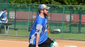 USSSA Holiday Classic Tournament A pitcher wearing shin guards throws an underhand slow pitch