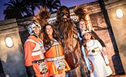 Family of runners pose with Chewbacca during Star Wars Half Marathon - The Light Side event. Family of runners pose with Chewbacca during Star Wars Half Marathon - The Light Side event.