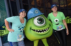Runners pose with Mike Wazowski during Disneyland Half Marathon Weekend at Disneyland Resort.