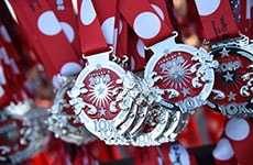 Walt Disney World 10K medals with Minnie Mouse theme.