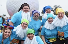Runners dressed as Snow White and the Seven Dwarfs run through Epcot during Walt Disney World Marathon Weekend.
