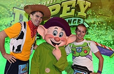 Runners pose with Dopey for the Dopey Challenge during Walt Disney World Marathon Weekend.