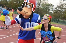Runner poses with Goofy at ESPN Wide World of Sports Complex during Walt Disney World Marathon.