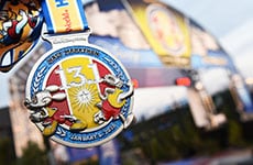 Walt Disney World Half Marathon medal featuring Mickey Mouse and Donald Duck.