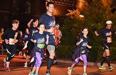 Family runs through Epcot for the Walt Disney World 5K.
