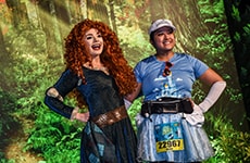 Runner poses with Merida during Disney Princess Half Marathon Weekend.