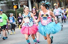 Participants run through Epcot for the Disney Princess 5K at Walt Disney World Resort.