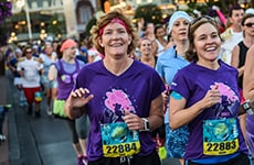 Runners run down Main Street, U.S.A. in Magic Kingdom Park during Disney Princess Half Marathon at Walt Disney World Resort.