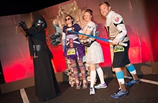 Runners pose with Kylo Ren before the Star Wars 5K during Star Wars Half Marathon – The Dark Side race weekend.