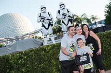 Runners pose with Kylo Ren before the Star Wars 5K during Star Wars Half Marathon – The Dark Side race weekend.