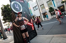 Runner poses at mile 4 of the Star Wars 10K for the Star Wars Dark Side Challenge during Star Wars Half Marathon – The Dark Side race weekend.