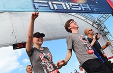2. Runners cross the finish line of the Star Wars Half Marathon – The Dark Side for the Star Wars Dark Side Challenge.