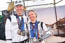 3. Runners dressed as Stormtroopers celebrate with their medals after Star Wars Half Marathon – The Dark Side.