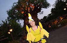 Runner dressed as Lumiere during Disney Wine & Dine Half Marathon in Disney's Animal Kingdom Theme Park