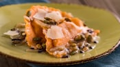 Ravioli paired with pumpkin seeds and shaved cheese