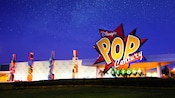 The illuminated exterior of Disney’s Pop Century Resort The illuminated exterior of Disney’s Pop Century Resort