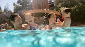 A family of enjoy the outdoor pool at Disney’s Grand Californian Hotel and Spa A family of enjoy the outdoor pool at Disney’s Grand Californian Hotel and Spa