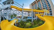 Water rushes down the curved flume of the California Streamin water slide and into the pool