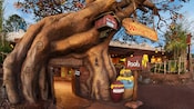 The sign and entrance to Pooh's house at The Many Adventures of Winnie the Pooh attraction