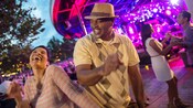 A couple rockin' out on the outdoor dance floor at Epcot