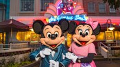 Mickey and Minnie Mouse are dressed to thrill while standing in front of the Hollywood and Vine marquee