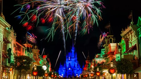 Fireworks bursting over Main Street U.S.A. and Sleeping Beauty Castle