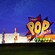 The illuminated exterior of Disney’s Pop Century Resort