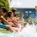 A family plays in the pool at Disneyland hotel