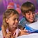 A boy and girl enjoy playing a game together at Disney’s Art of Animation Resort