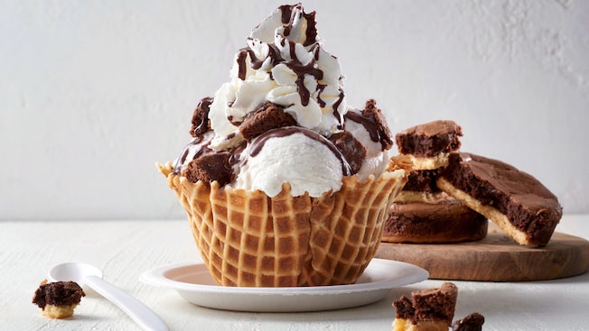 3 scoops of gelato with Nutella brownie chunks, chocolate sauce and whipped cream in a waffle bowl