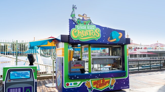 A sign featuring Buzz Lightyear identifies Senor Buzz Churros, an eatery