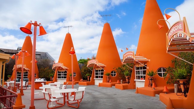 A row of oversize construction cones make up Cozy Cone Motel snack stands in Cars Land