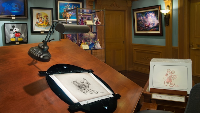 A sketch of Mickey Mouse from Steamboat Willie showcased on an artist's easel inside Disneyana