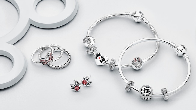 Disney-themed rings, earrings, and bracelets with beads.