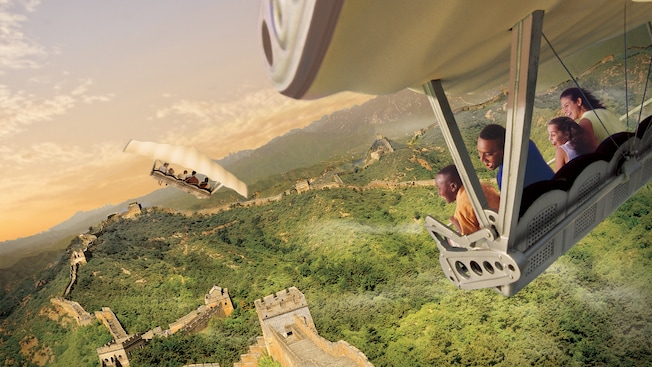 A family of Guests smiles while flying above the Great Wall of China during Soarinâ Around the World