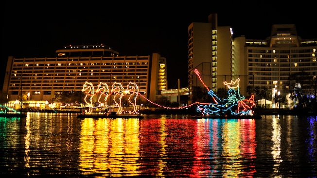 A light display of 4 seahorses pulling King Neptune at the Electrical Water Pageant