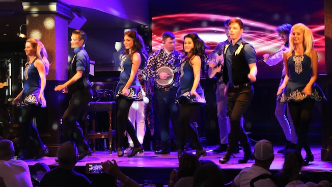 Irish Dancers perform on stage with a live band