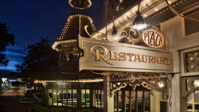 Front of The Plaza Restaurant trimmed in lights  