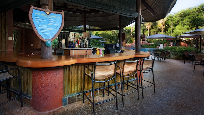 The open-air Uzima Springs Pool Bar with chair-stools