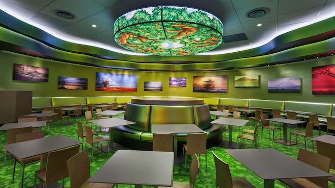Dining area featuring storybook art and circular light fixture from Disney's 'The Lion King'