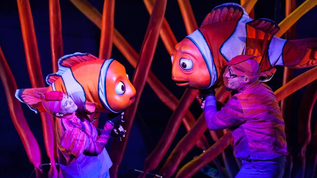 Actors holding Nemo and his father Marlin at Finding Nemo - The Musical